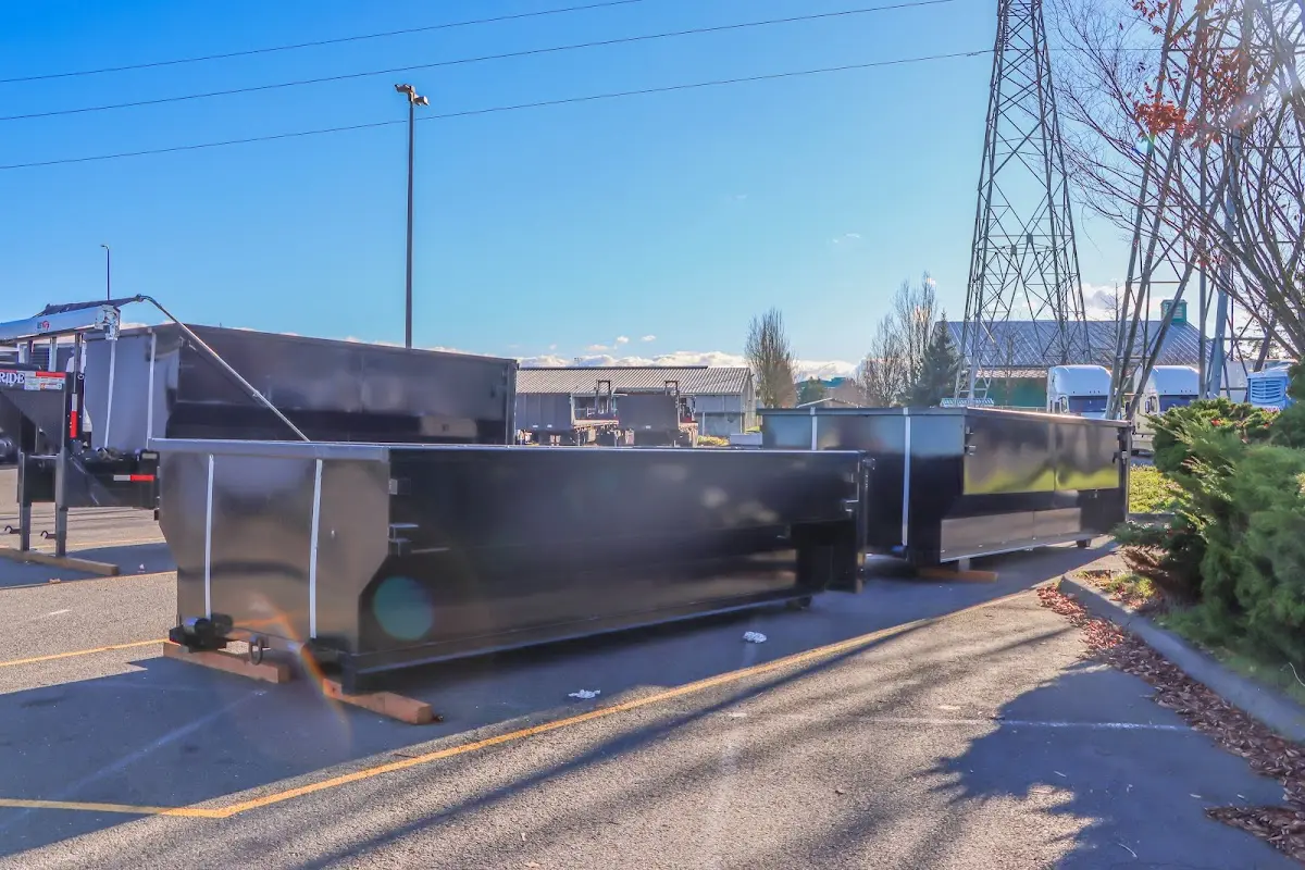 Roll-off dumpster ready for waste disposal at job site for Concrete Dumpster Rental in Seaside